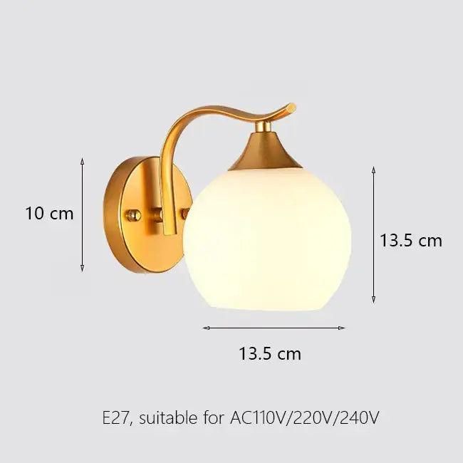 Elegant gold iron wall lamp with frosted glass shade and curved arm for bedroom decor by decorbites iron wall lamp