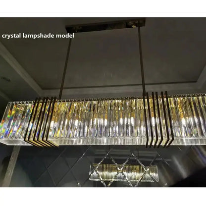Elegant gold lustre pendant light with long rectangular crystal lampshade and gold-toned metal accents by decorbites elegant gold