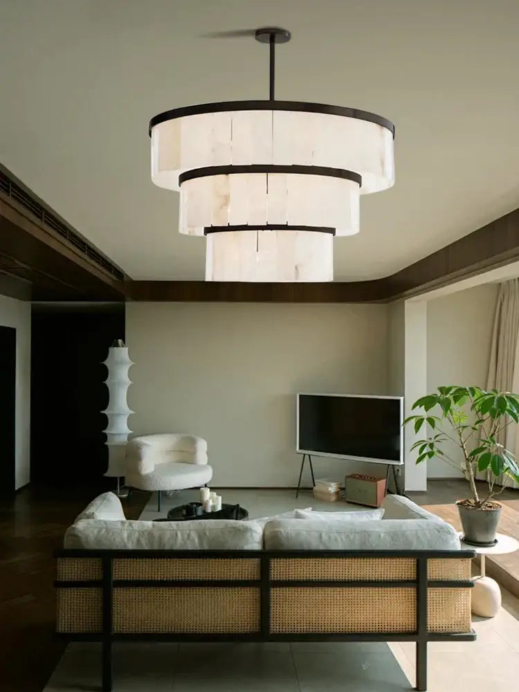 Modern tiered pendant light with layered white shades and dark metal frames for elegant gold marble ceiling decorbites design