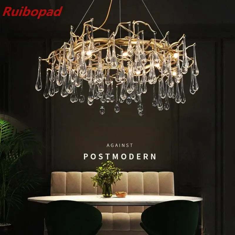 Elegant gold metal branch chandelier with glass water drop crystals and dangling teardrop pendants for dining room light