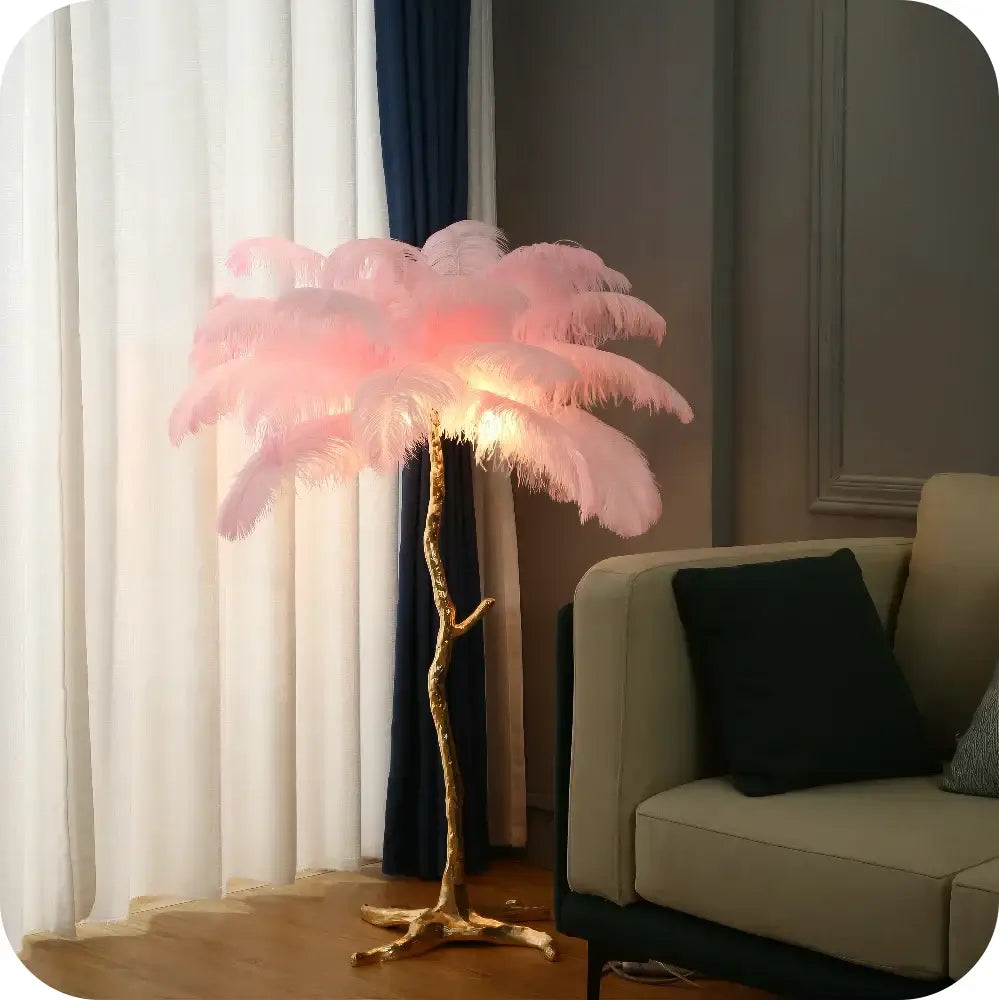 Elegant gold ostrich feather floor lamp with delicate pink feathers and a golden tree-like base for bedroom decorbites elegant ostrich design