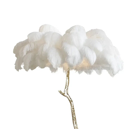 Elegant gold ostrich feather floor lamp with white feathers and slender metallic gold stem for decorbites elegant ostrich decor