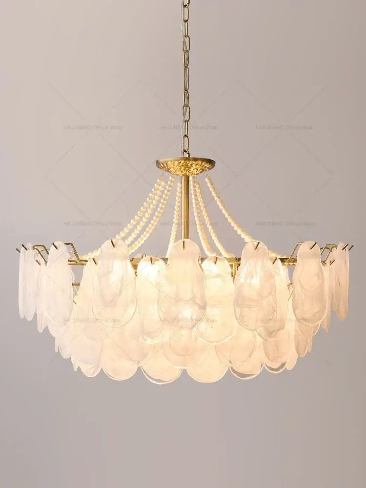 Elegant gold pearl shell chandelier garden light with translucent glass shades and delicate pearl strands for dining room