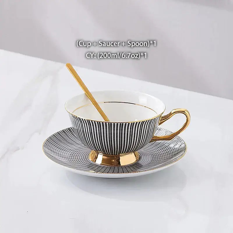 Elegant black and white striped porcelain teacup with gold trim, matching saucer, and golden spoon in decorbites gold porcelain tea set