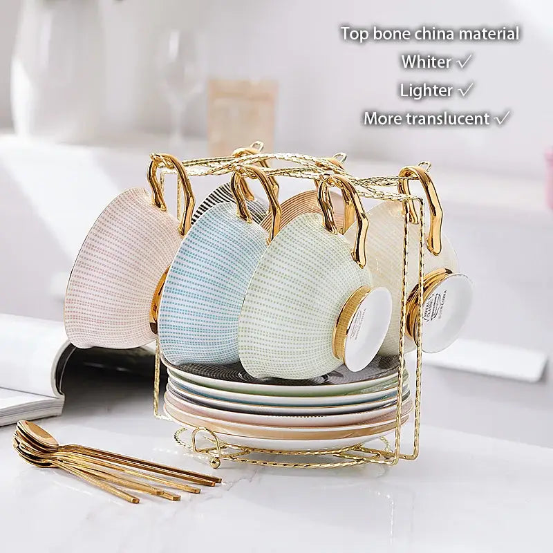Elegant gold porcelain tea set rack with bird figurine holding pastel bone china mugs with subtle textured patterns