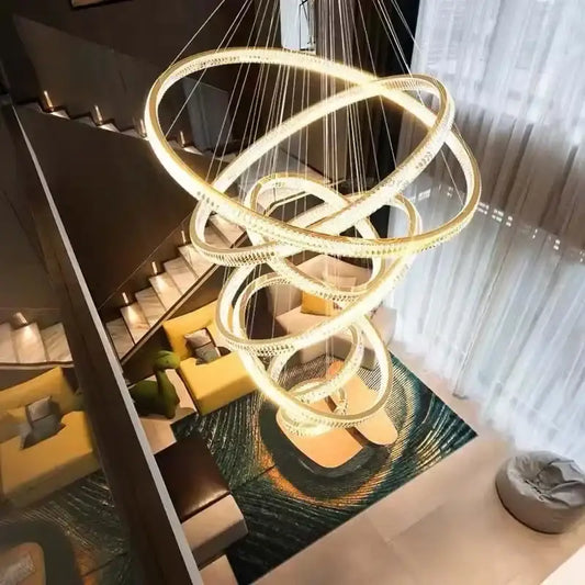 Elegant gold rings chandelier features a golden spiral design with interlocking rings and crystal accents for decorbites elegant gold decor