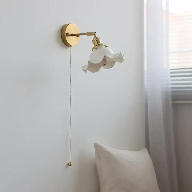 Elegant white ceramic led wall light with fluted petal shade and brass arm for decorbites ceramic led bedroom sconce