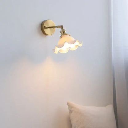 Elegant gold ruffled ceramic led wall light with warm-toned brass sconce and scalloped glass shade for bedroom decorbites ceramic led wall