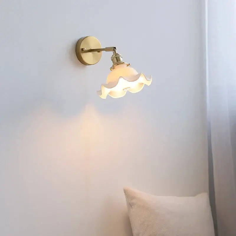 Elegant gold ruffled ceramic led wall light with warm-toned brass sconce and scalloped glass shade for bedroom decorbites ceramic led wall