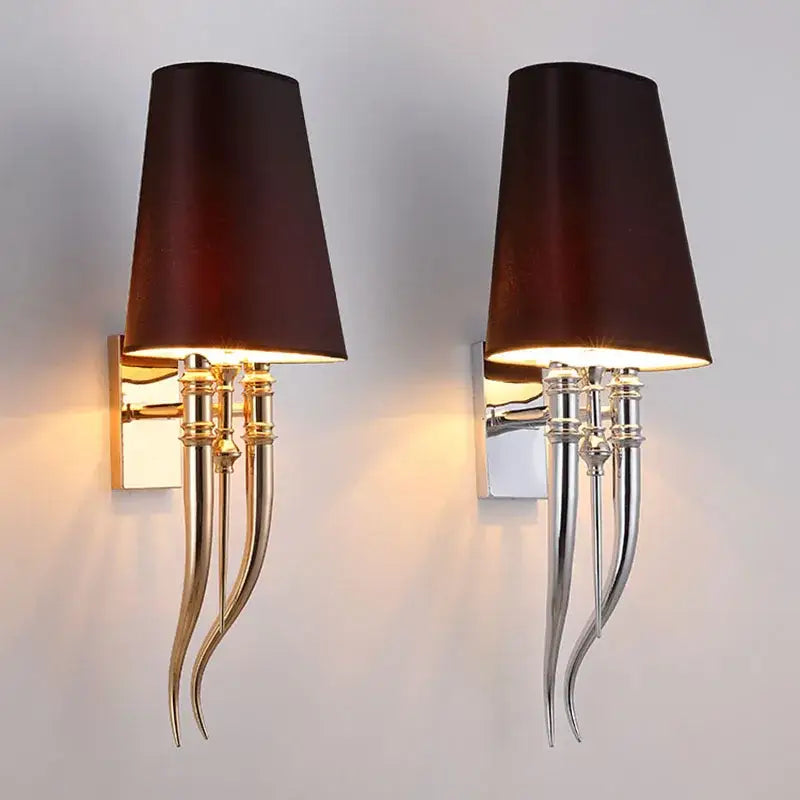 Pair of elegant iron claw horn wall sconces with dark brown fabric shades and gold silver iron arms for bedroom use