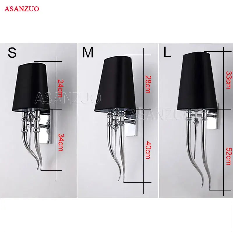 Black fabric lampshade on chrome iron claw horn wall sconce with curved metal arm for elegant bedroom lighting pair