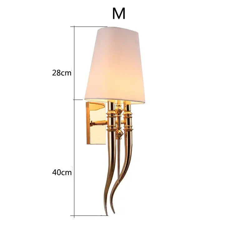 Elegant gold and silver iron claw horn wall sconce with gold-toned curved arms and tapered off-white fabric shade for bedroom pair