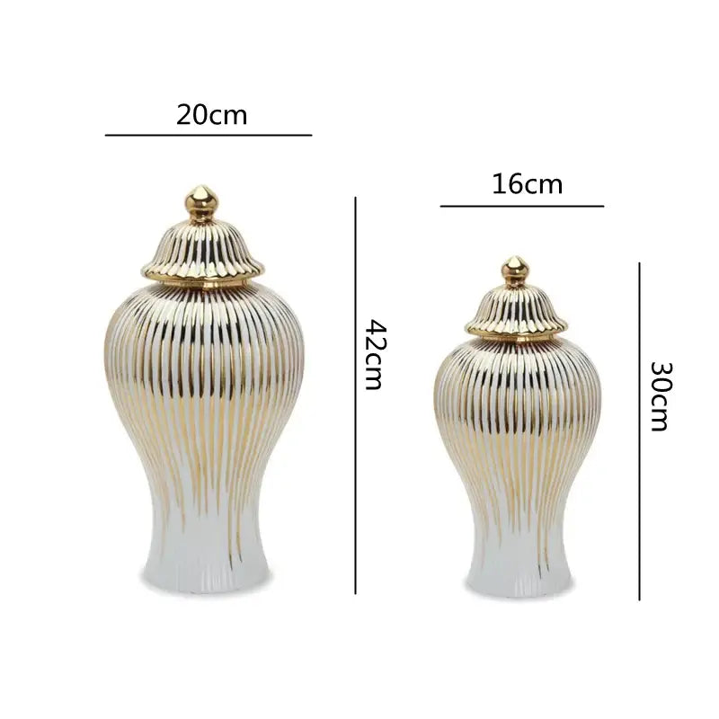 Two elegant gold striped ceramic ginger jars with ribbed detailing and gold-toned lids for living room storage