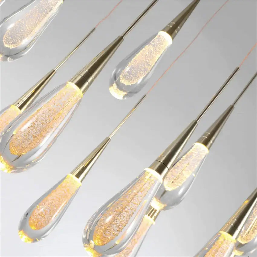 Elegant gold teardrop crystal glass led pendant lights with brass caps and golden glitter for dining room decorbites crystal glass