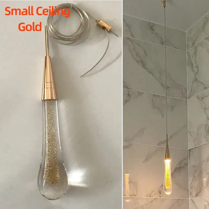 Elegant gold teardrop crystal glass pendant light with golden glitter for dining room decorbites crystal glass design