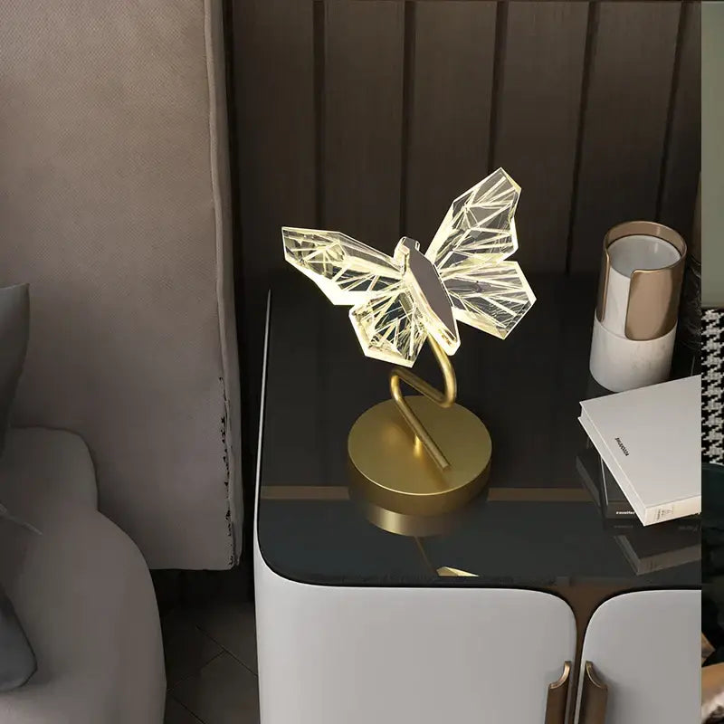 A modern geometric led lamp with translucent facets and gold-toned base in decorbites butterfly chandelier style
