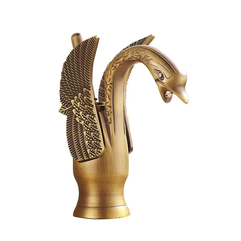 Elegant golden swan faucet with intricately detailed brass wings and neck for bathroom hot and cold mixer tap