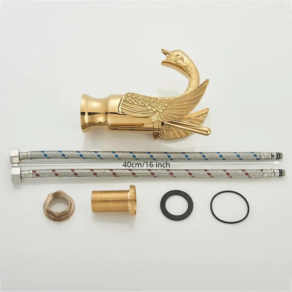Elegant golden swan faucet with ornate goose shape, detailed feather engraving, and polished metallic finish for bathroom use