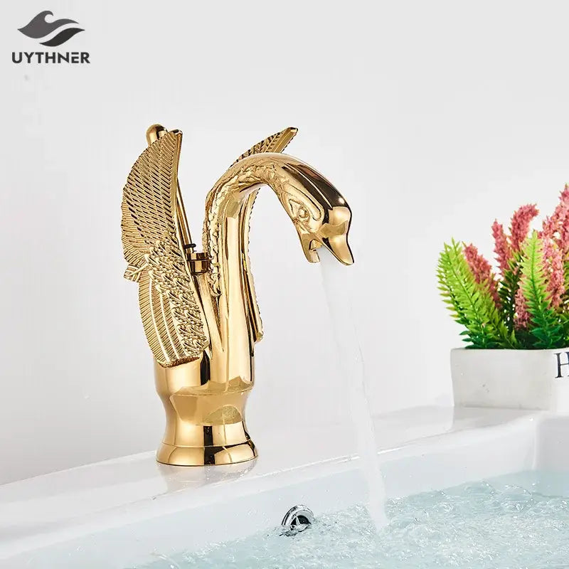 Elegant golden swan faucet bathroom mixer tap with detailed feathered wings and polished metallic finish