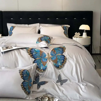 Elegant white satin bedding set with decorbites butterfly embroidery in blue and gold for refined bedroom linens