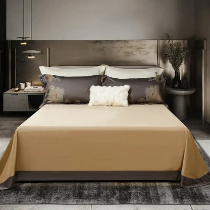 Beige satin bedspread with subtle sheen draped over mattress in elegant gray and gold 1500tc egyptian cotton bedding set