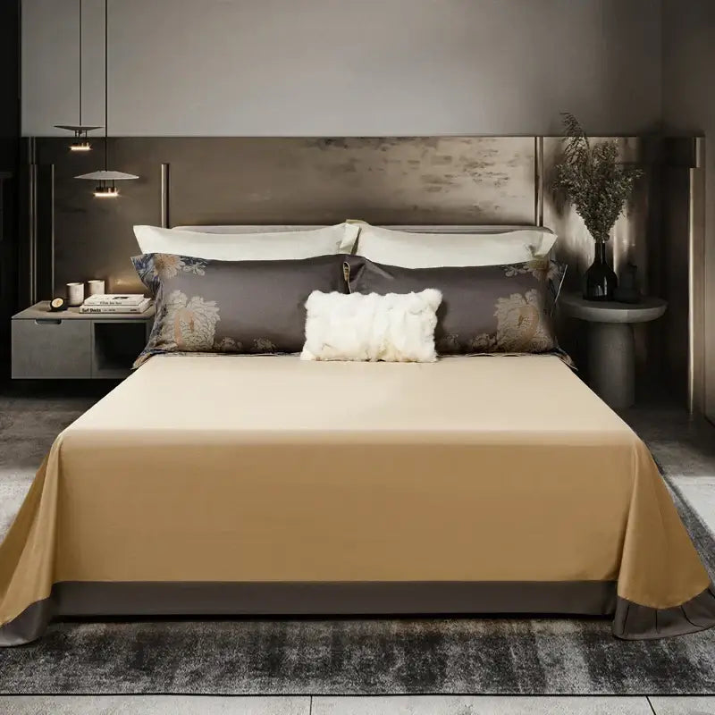 Beige satin bedspread with subtle sheen draped over mattress in elegant gray and gold 1500tc egyptian cotton bedding set
