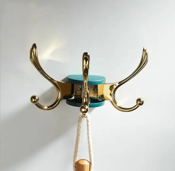 Elegant green gold zinc alloy three-hook coat hook with a teal circular base for bathroom wall mount use