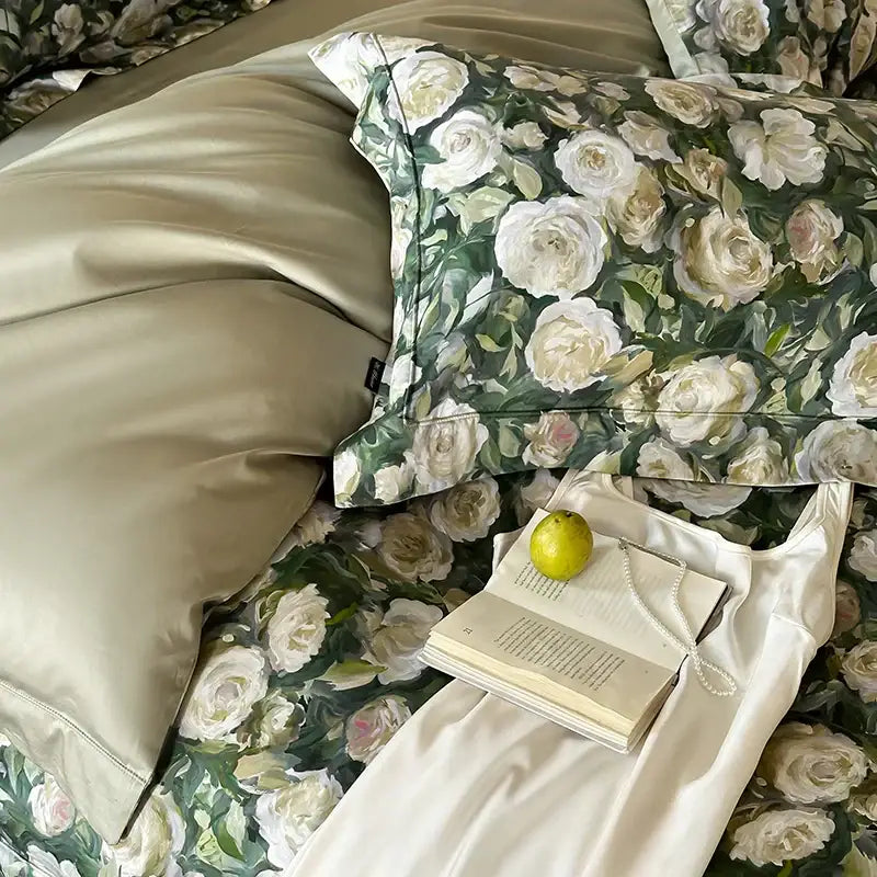 A satin pillowcase with white and cream roses green foliage on dark background from elegant decorbites 1000tc egyptian cotton bedding set