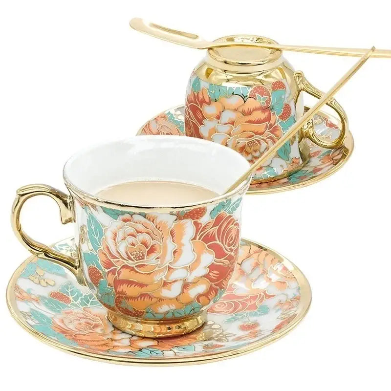 Elegant hand painted flower ceramic coffee cup set with gold trimmed handles and vibrant coral peach teal floral pattern