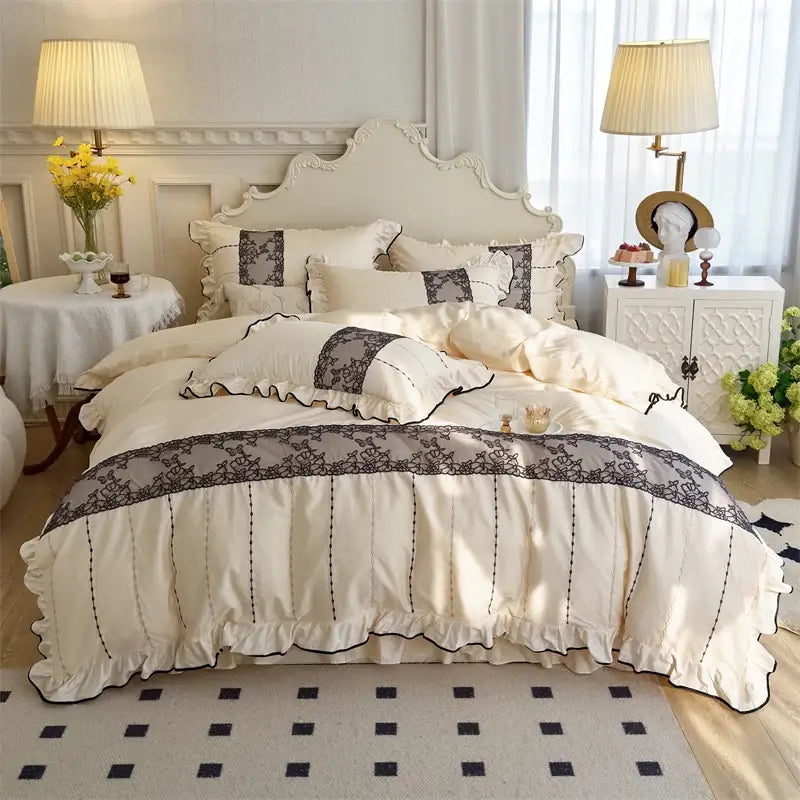 Cream-colored satin bedding set with delicate black lace trim and ruffled edges for decorbites elegant heart collection