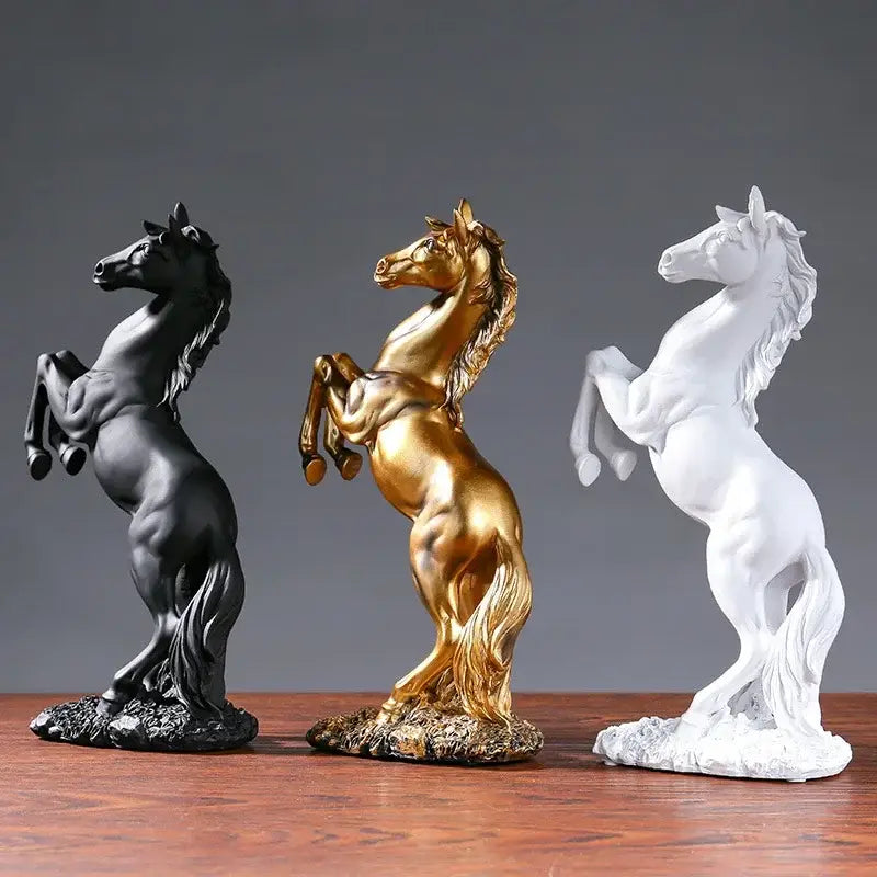 Three elegant decorbites horse resin sculptures in black gold and white with detailed manes for living room decor