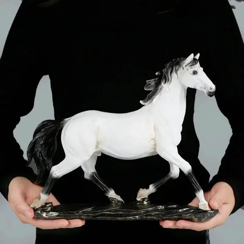 Elegant horse resin statue featuring a sleek white horse with black mane and tail crafted from glossy resin