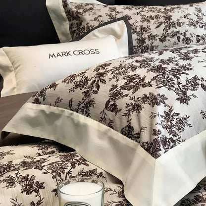 Elegant ivory and dark brown floral egyptian cotton pillowcase with satin trim from mark cross bedding sets