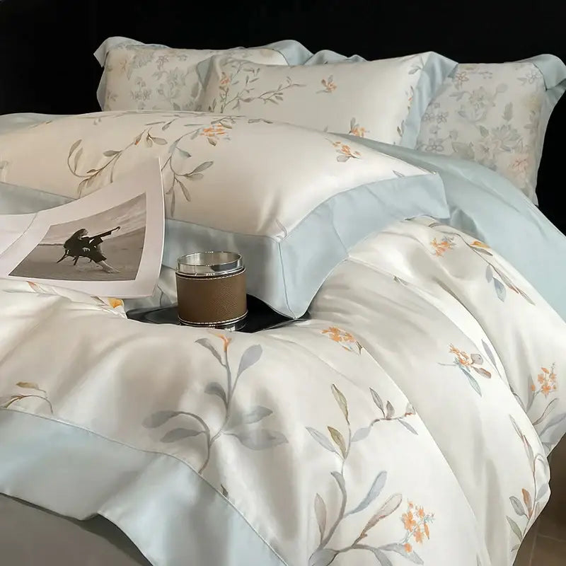 Elegant ivory floral eucalyptus fiber bedding set in cream and light blue with orange blossoms for decorbites eucalyptus fiber decor