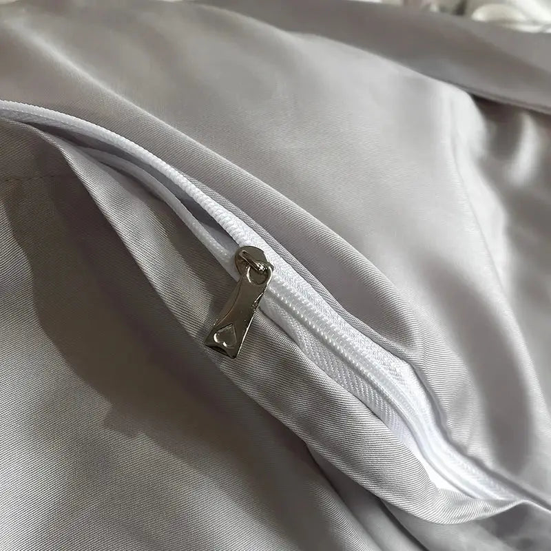 Silver-toned zipper with metallic pull tab on elegant ivory floral eucalyptus fiber bedding set for decorbites eucalyptus fiber