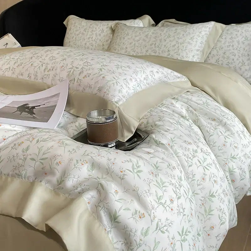 Cream-colored satin pillowcases with delicate green and pale yellow floral embroidery in eucalyptus fiber bedding set decorbites eucalyptus fiber
