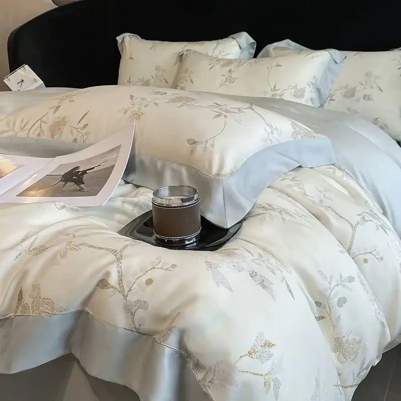 Elegant ivory satin bedding set with gold and gray floral embroidery made from eucalyptus fiber decorbites eucalyptus fiber