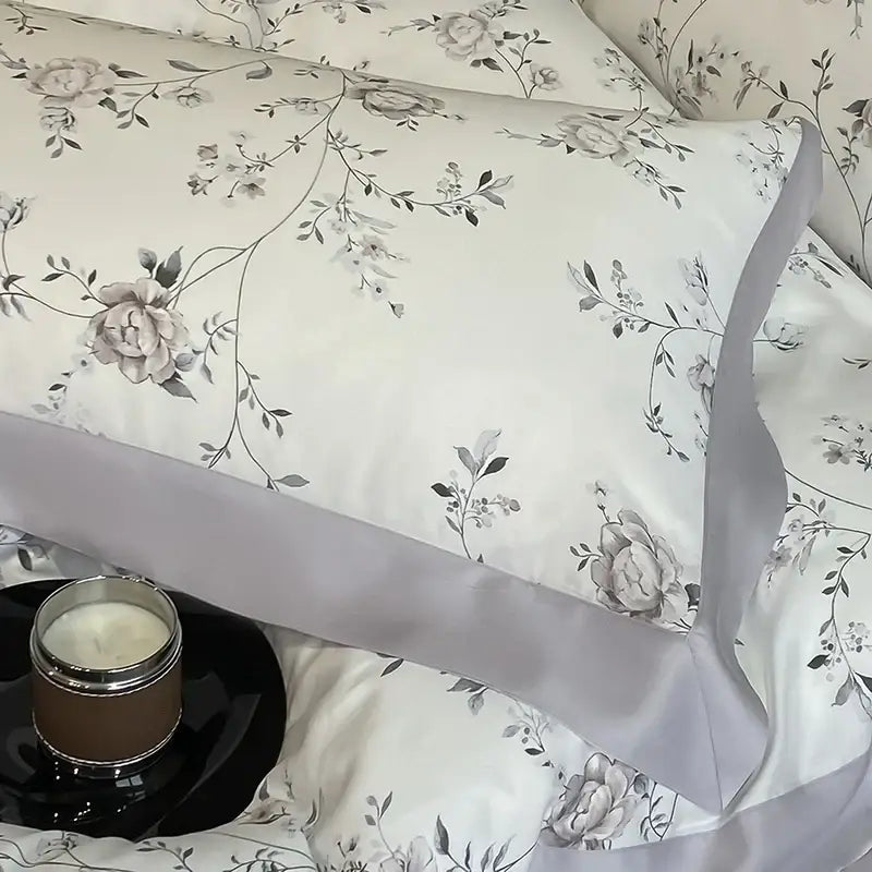 Elegant ivory satin pillowcase with gray floral embroidery and lavender ribbon trim from decorbites eucalyptus fiber bedding set