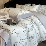 Elegant ivory satin bedding set with delicate gray floral embroidery made from eucalyptus fiber for decorbites eucalyptus fiber collection