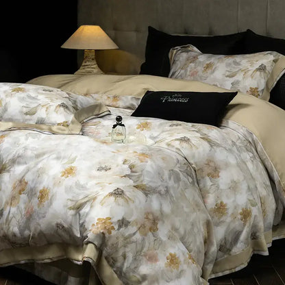 Elegant ivory floral print eucalyptus fiber bedding set featuring beige and cream satin with delicate gold-toned blossoms