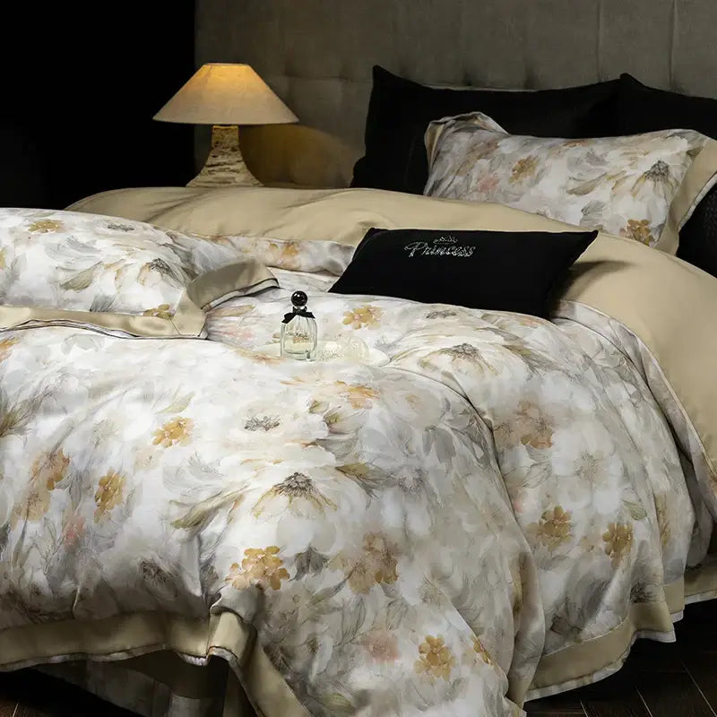 Elegant ivory floral print eucalyptus fiber bedding set featuring beige and cream satin with delicate gold-toned blossoms