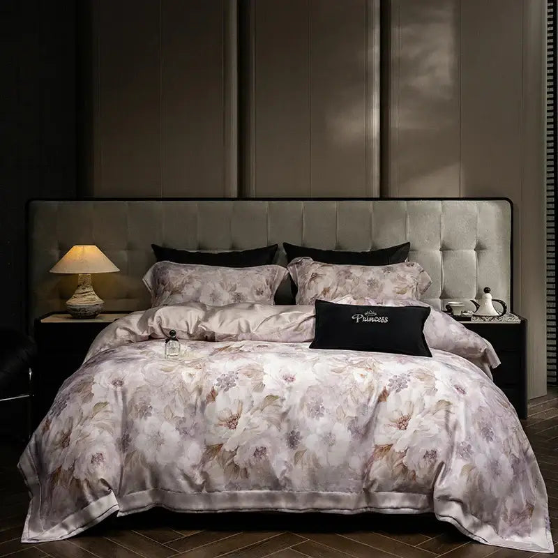 Elegant ivory floral print eucalyptus fiber bedding set with delicate pastel pattern on satin-like fabric and elegant stitching