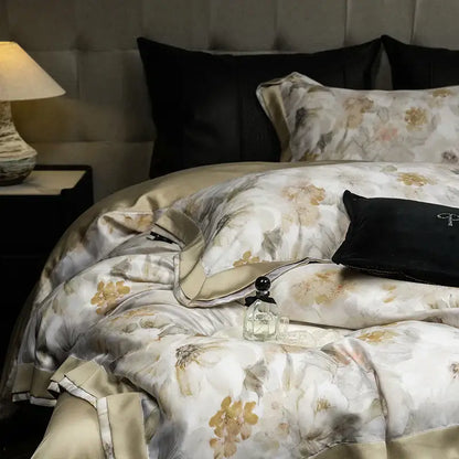 Elegant ivory floral print eucalyptus fiber bedding set featuring a gold satin duvet with subtle sheen and floral pattern