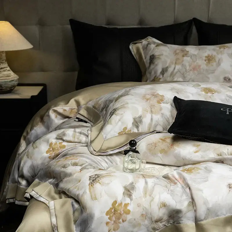 Elegant ivory floral print eucalyptus fiber bedding set featuring a gold satin duvet with subtle sheen and floral pattern