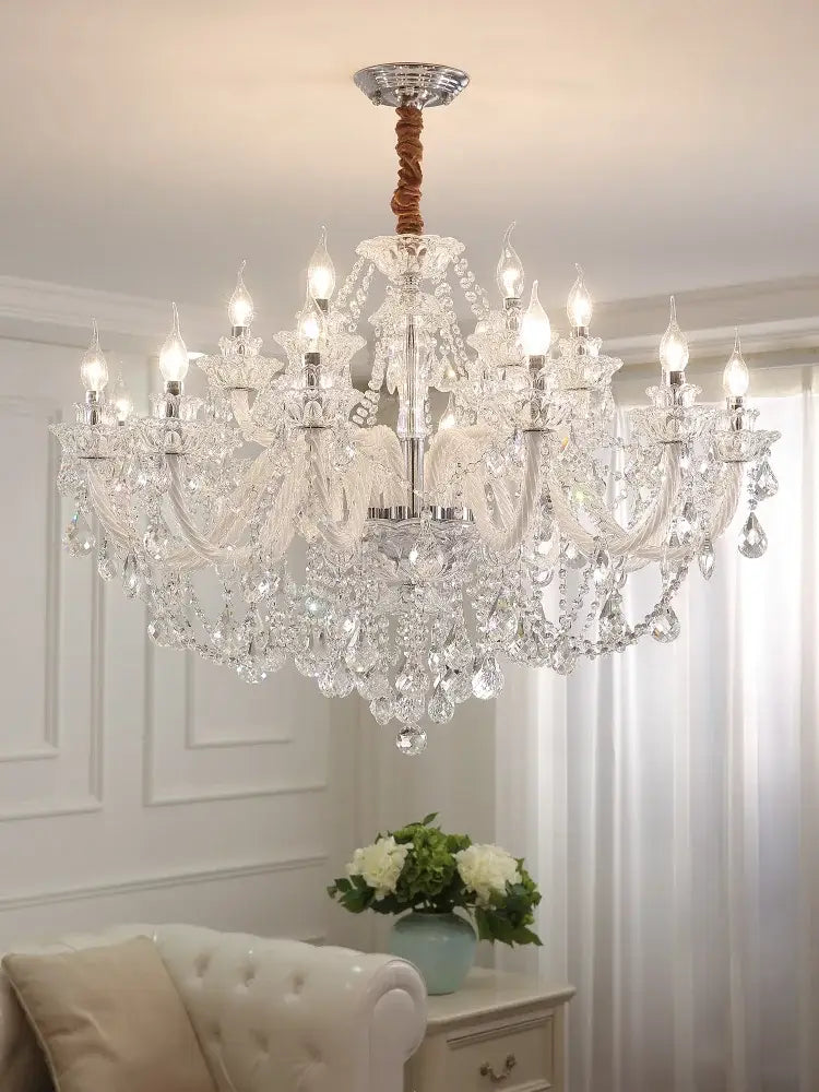Elegant led crystal chandelier with multiple arms, polished chrome center, and twisted brown cord for dining room lighting