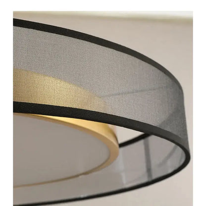 Elegant led dual purpose chandelier featuring a modern drum-shaped gray fabric lampshade with black trim and gold ring