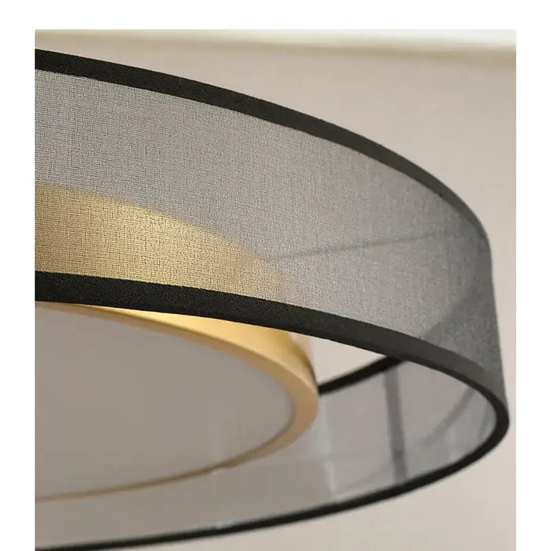 Elegant led dual purpose chandelier featuring a modern drum-shaped gray fabric lampshade with black trim and gold ring