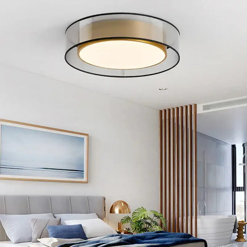 Elegant led dual purpose chandelier with gold-toned disc, clear glass rings, and black trim for living room lighting