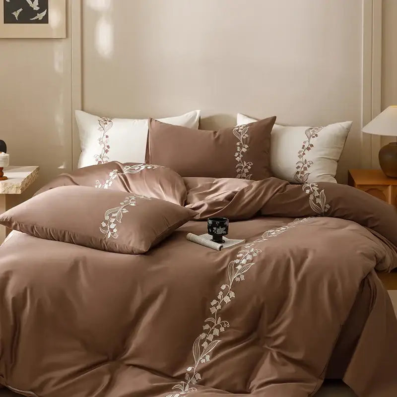 Brown satin duvet cover set with delicate white floral embroidery from decorbites elegant lily cotton bedding set
