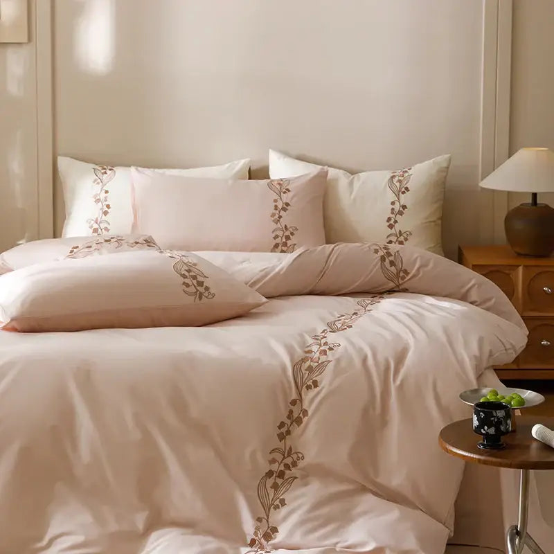 Beige linen duvet bedding set with delicate brown floral embroidery on pillows and edges decorbites elegant lily cotton bedding